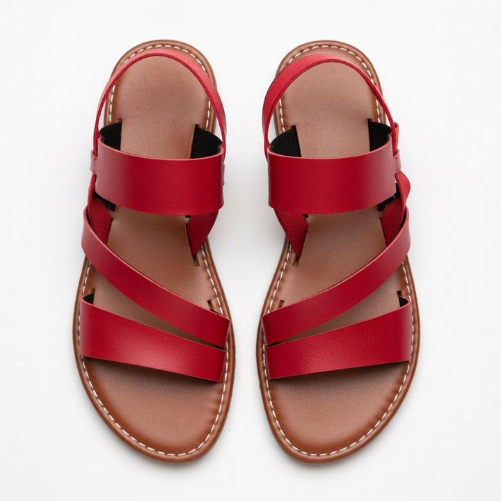 Trendy women's flat sandals featuring a comfortable open-toe design & chic crossover straps.