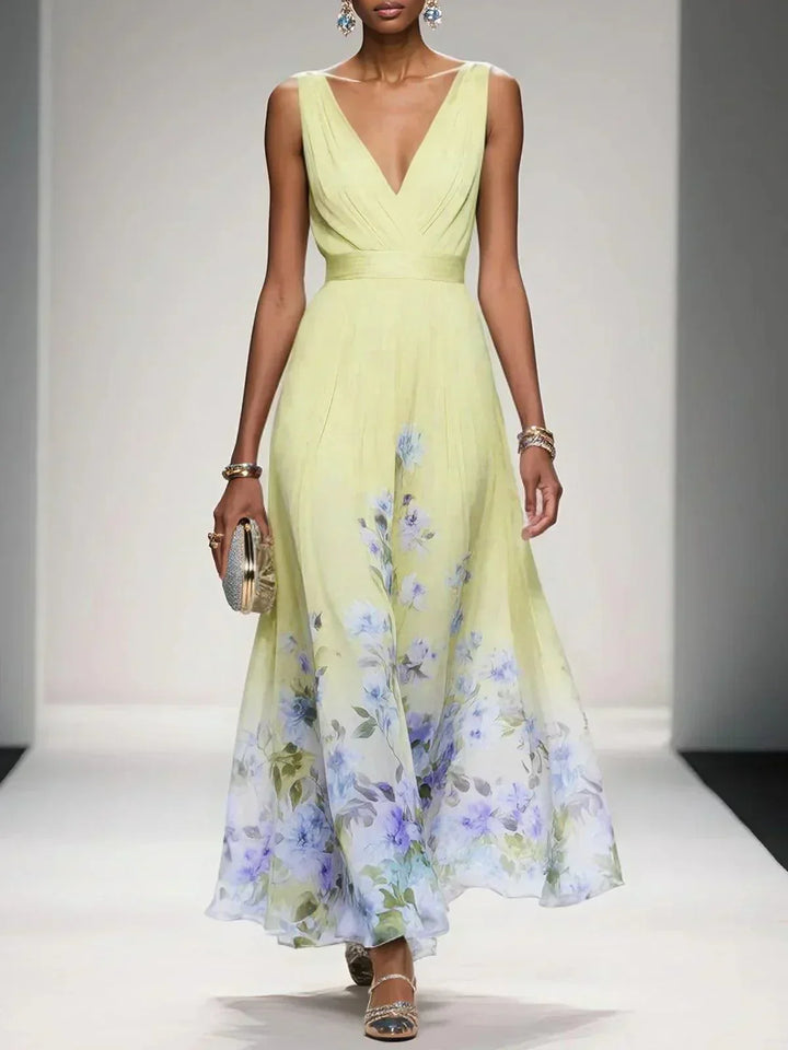 Flowing silhouette floral midi dress with V-neck, designed to flatter women's figures.