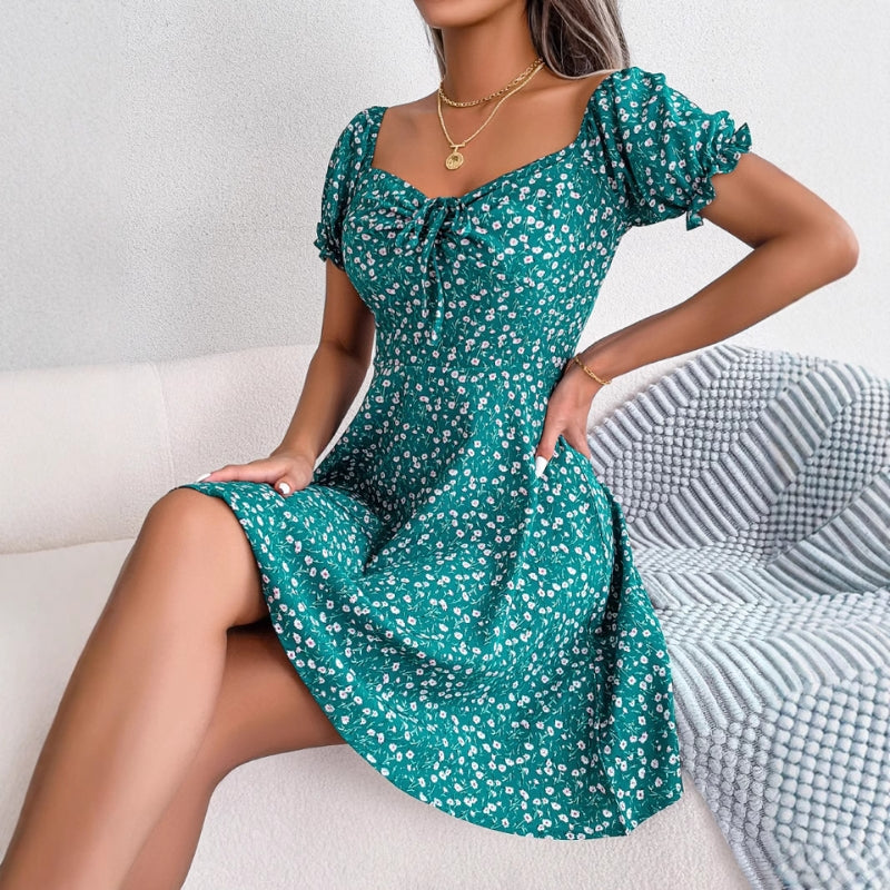 Close-up of a women's floral A-line dress, showcasing the vibrant print and ruffles