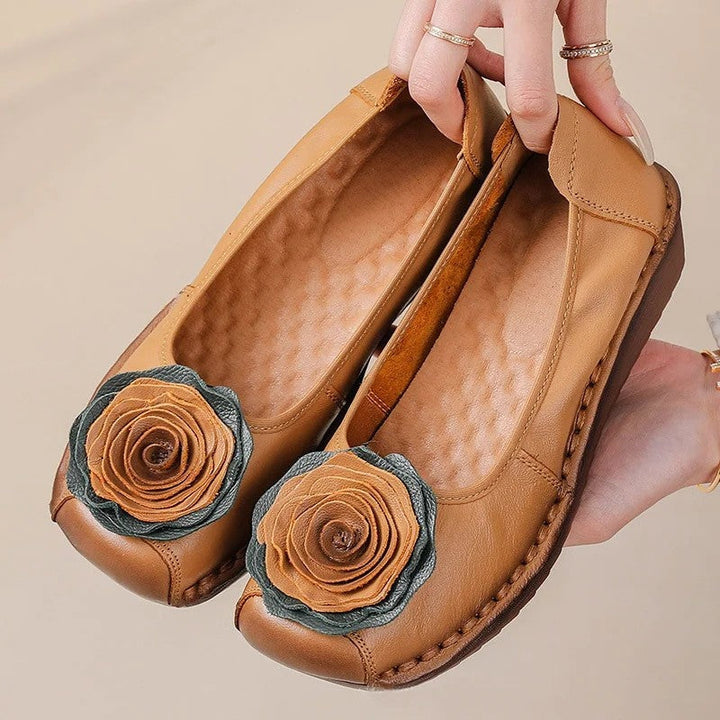 Soft women's comfort loafers, easy slip-on style with charming floral detail.