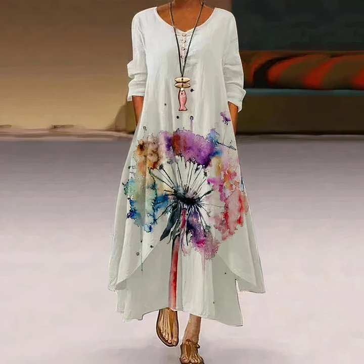 Comfortable everyday floral maxi dress with long sleeves, V-neck, and artistic border print.