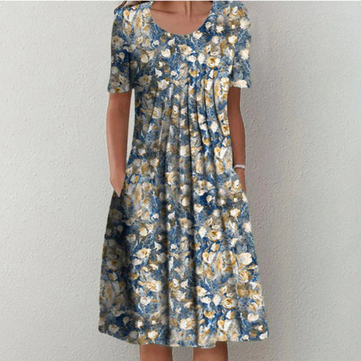 Versatile women's floral A-line casual dress. Features short sleeves, round neck & side pockets for everyday wear.