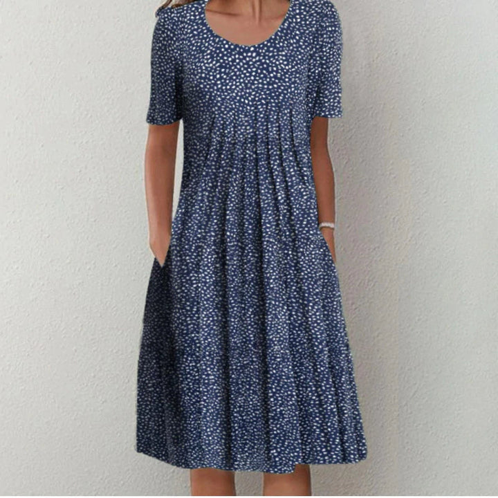 Lightweight women's floral casual midi dress. Short-sleeve, A-line design, round neck. Ideal for summer comfort.