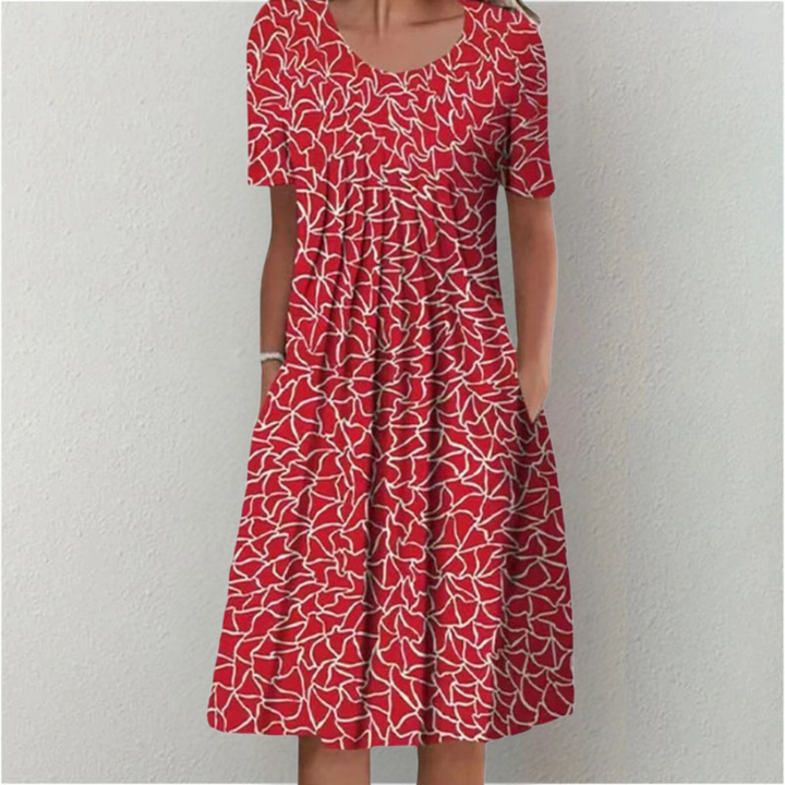 Stylish women's floral casual dress with practical pockets. Short sleeve, A-line midi dress, comfortable for day wear.