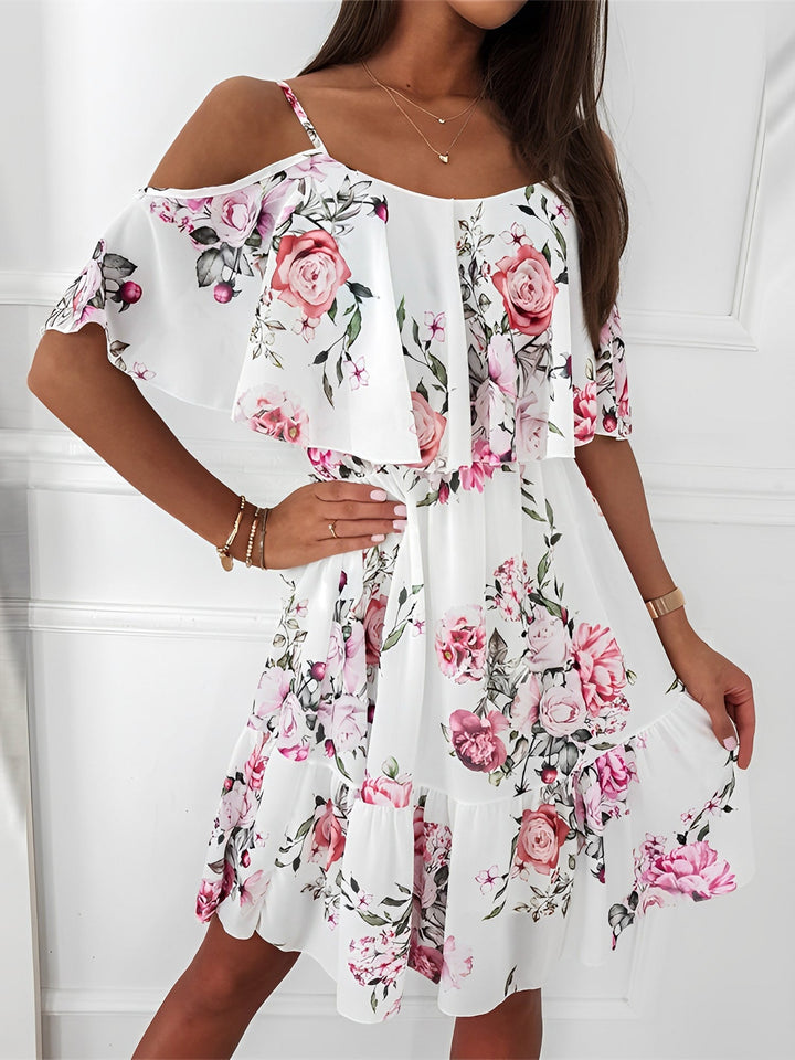 Women's floral cold shoulder mini dress with elegant ruffle trim, perfect for summer parties & vacations.