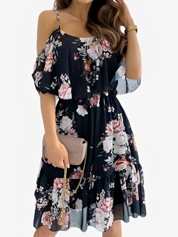 Pretty women's floral mini dress with cold shoulder cut and delicate ruffle trim, a stylish spring outfit.