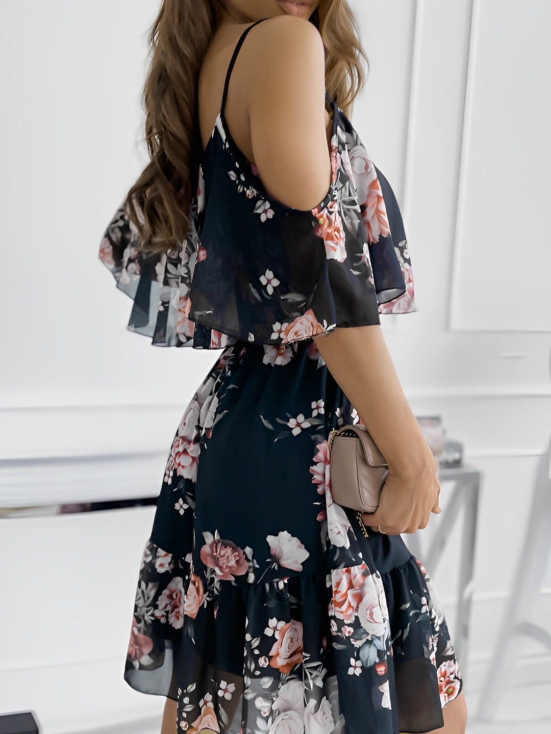 Trendy women's floral cold shoulder short dress, featuring a flattering flowy fit and elegant ruffle accents.