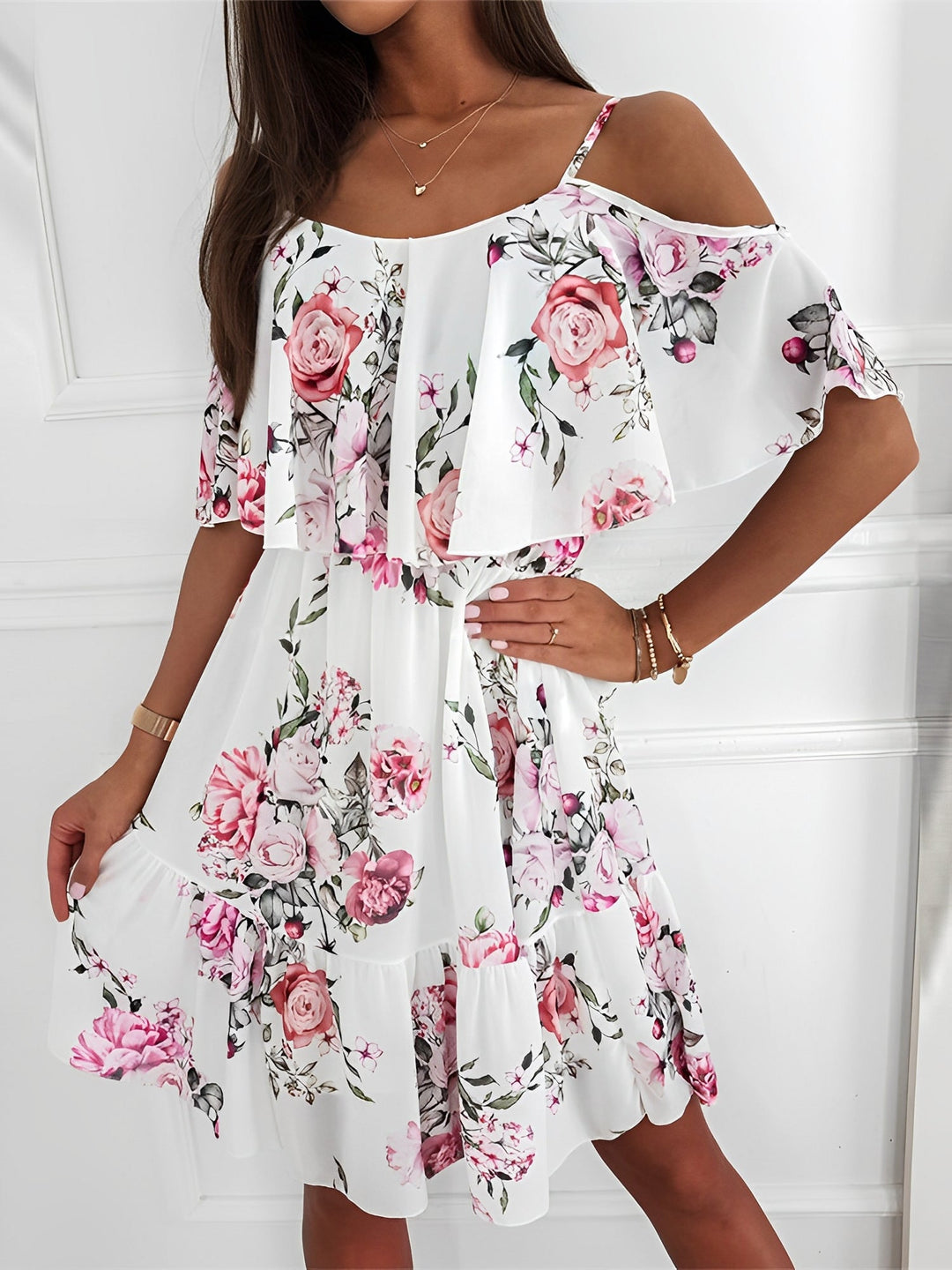 Elegant women's cold shoulder mini dress in a vibrant floral print with stylish ruffle trim.