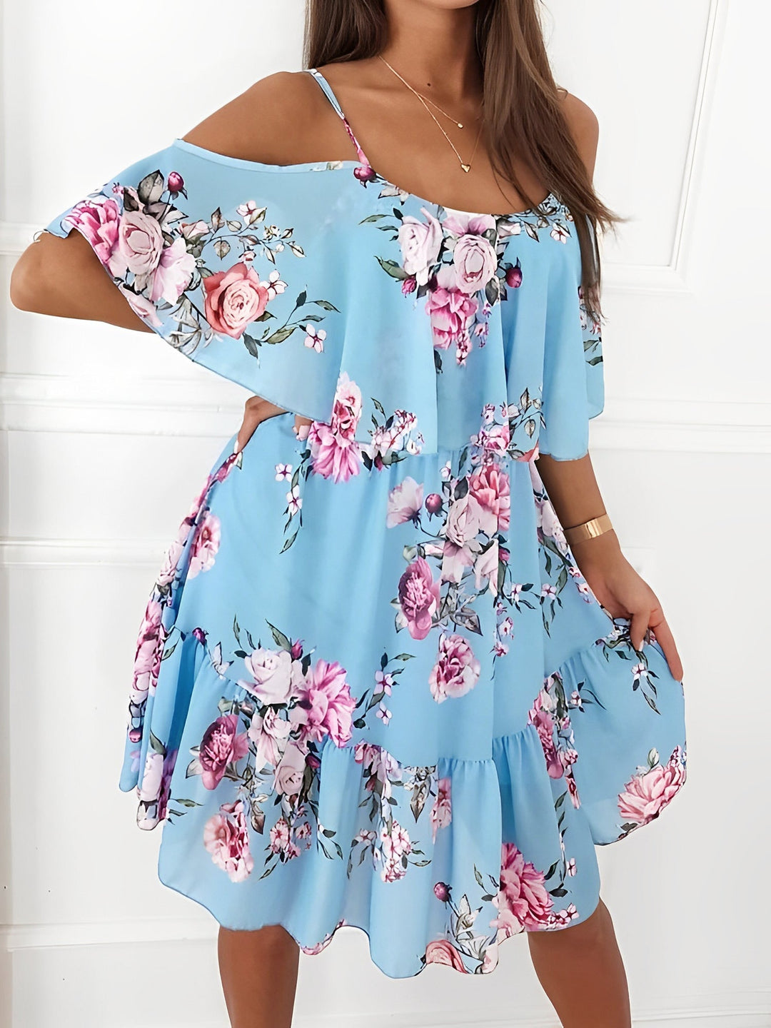 Floral pattern mini dress for women, featuring a trendy cold shoulder cut and flirty ruffle trim.