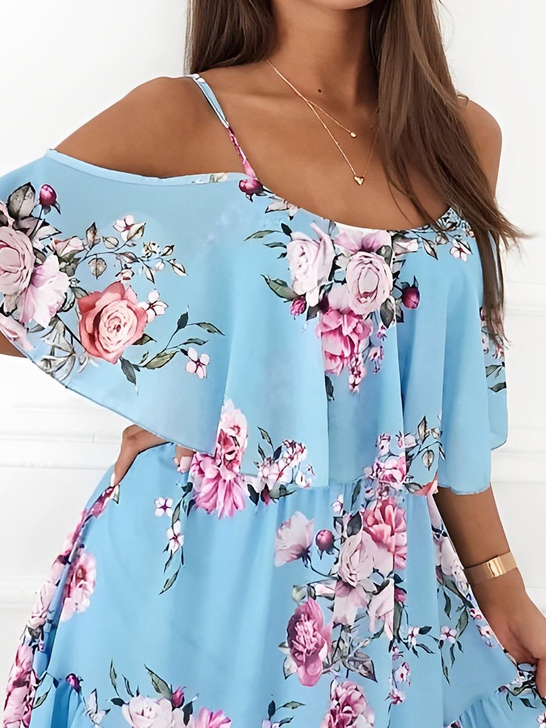 Short floral women's dress with a cold shoulder design & delicate ruffle details, great for spring/summer.