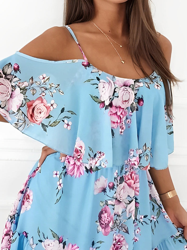 Short floral women's dress with a cold shoulder design & delicate ruffle details, great for spring/summer.
