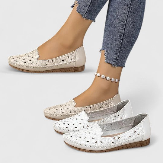 Women's floral cutout slip-on ballet flats. Perforated design, round toe, comfortable for spring/summer.