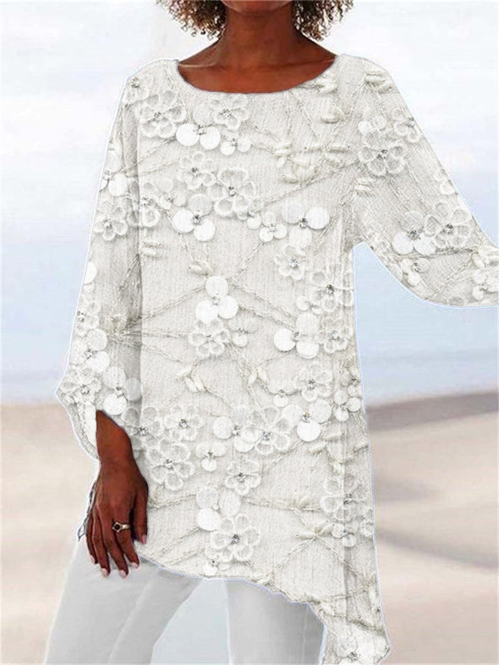 Feminine women's long sleeve tunic top with unique floral embroidery & asymmetrical hem. Perfect for everyday style.