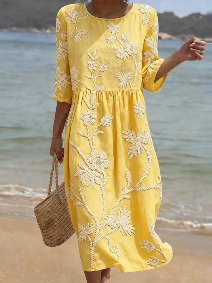 Elegant ladies' flowing maxi dress with floral embroidery & 3/4 sleeves. A versatile choice for summer events.