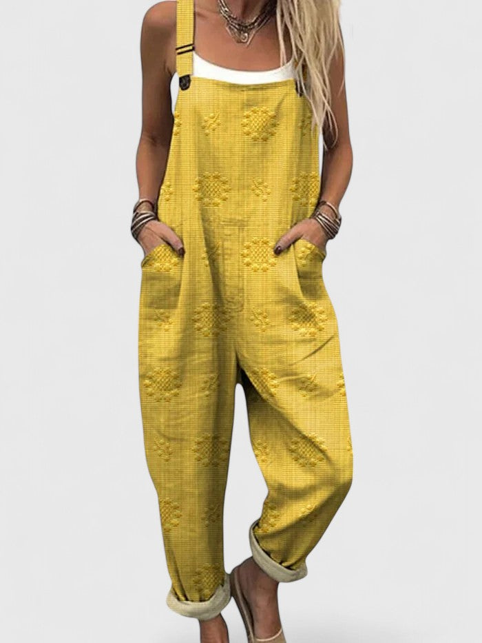 Easy-wear women's floral embroidered overalls. Loose fit design with pockets for ultimate spring/summer comfort.