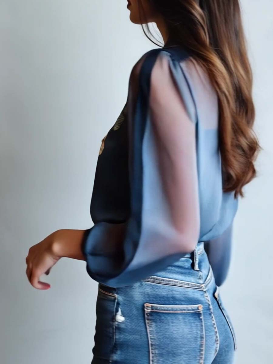 Elegant women's blouse with intricate floral embroidery, sheer sleeves & v-neck style.