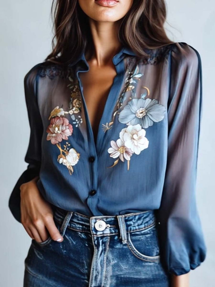 Feminine women's floral embroidered sheer sleeve blouse with a flattering v-neck design.