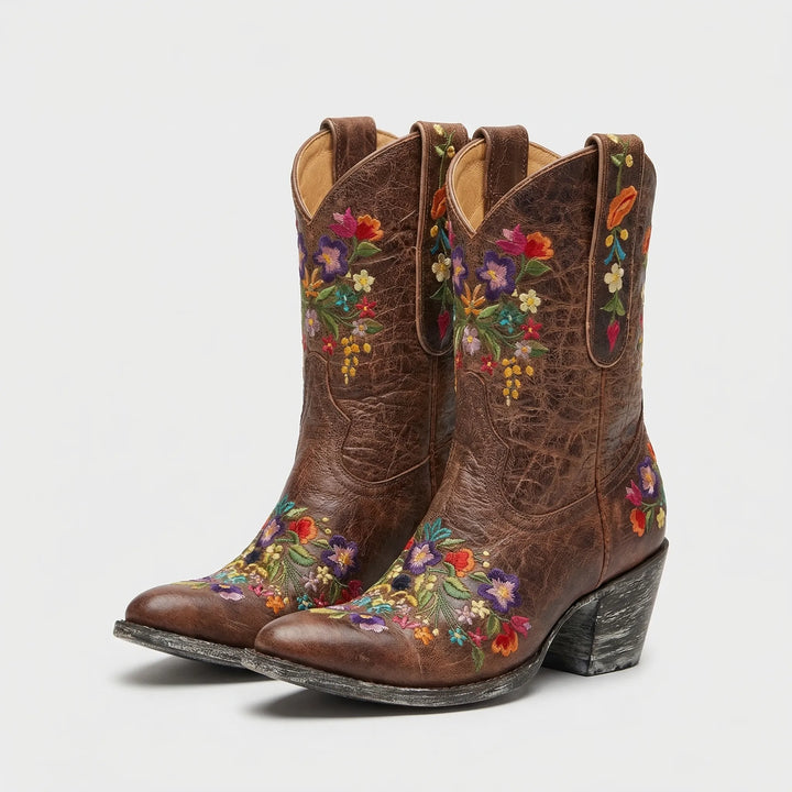 Statement women's floral embroidered western ankle boots, ideal for outdoor adventures & stylish wear.