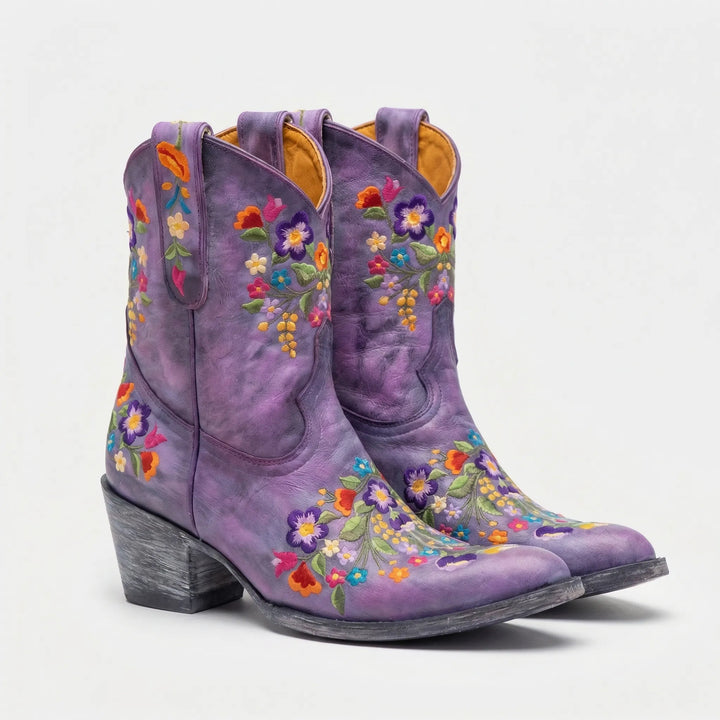 Elegant women's floral embroidered pull-on ankle boots with a comfortable block heel and pointed toe.