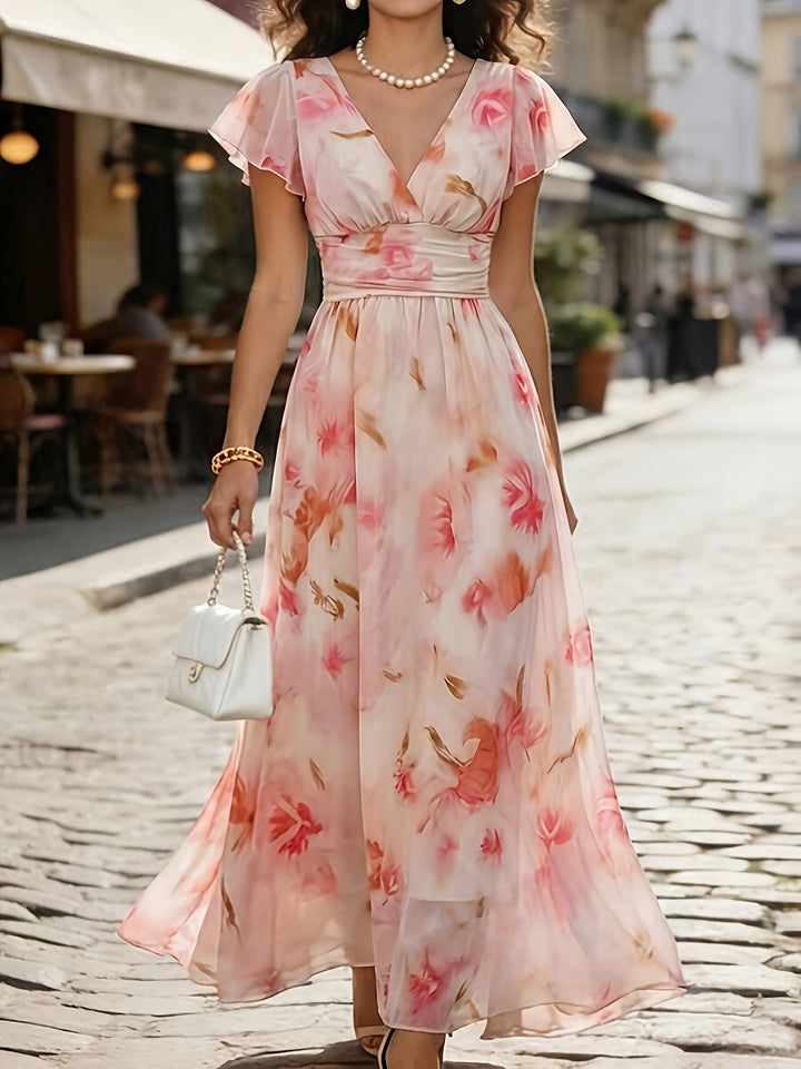 Summer-ready women's floral flutter sleeve maxi dress. Deep V-neck, flowy design for comfort.