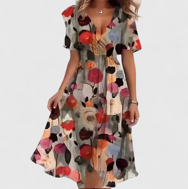 Elegant women's v-neck floral midi dress with delicate flutter sleeves, offering effortless everyday style.