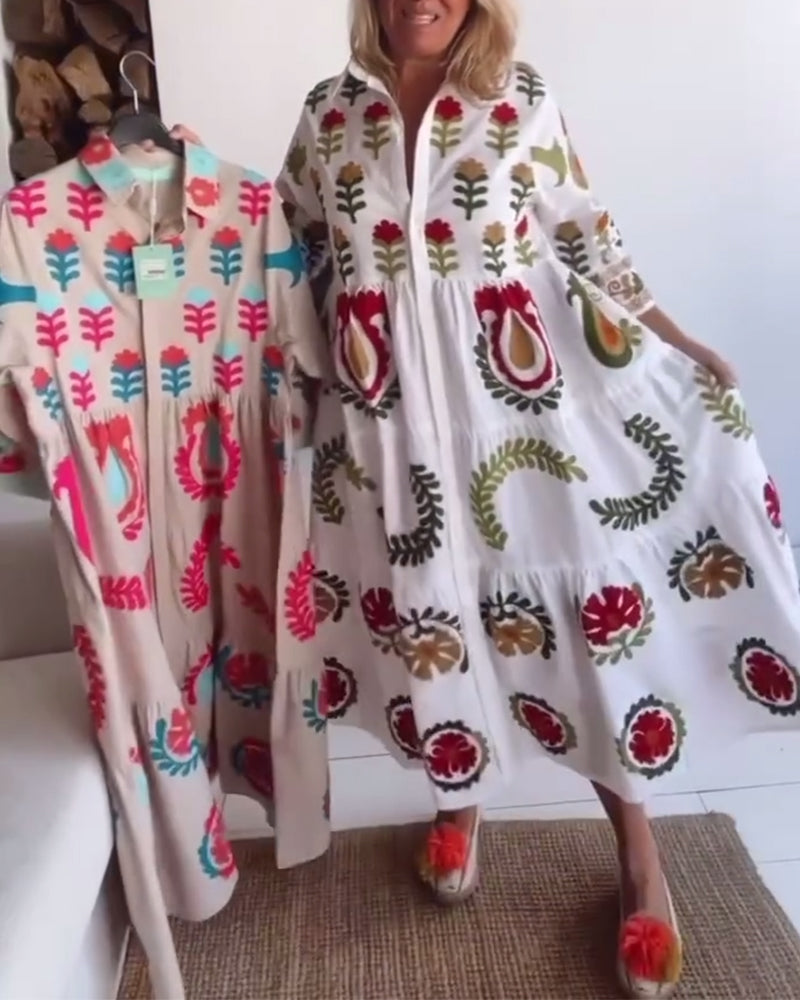 Close-up of a women's floral graphic print midi dress, showcasing vibrant flowers and lapel.