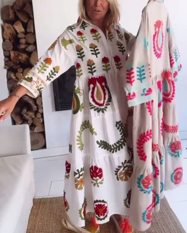 Chic A-line midi dress for women, featuring a bold floral graphic and sophisticated lapel collar.