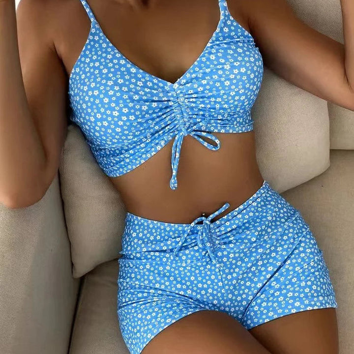 Supportive high-waist floral bikini set, flattering retro swimsuit for women's summer fashion.