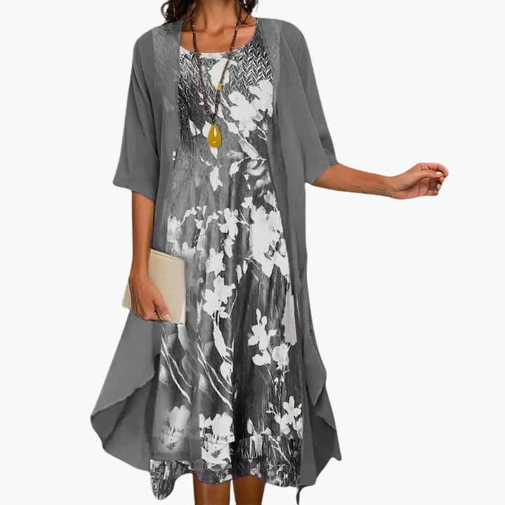 Elegant women's long dress and cardigan ensemble; a fashionable floral print layered outfit for any occasion.