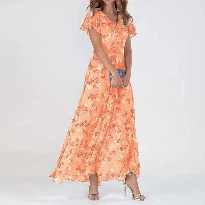 Women's floral maxi dress with elegant flutter sleeves & a flattering V-neck, perfect for summer fashion.