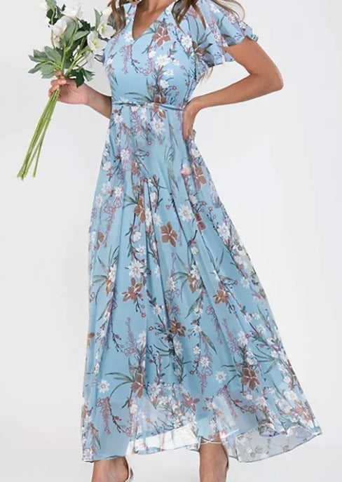 Stylish women's floral maxi dress for summer parties or casual elegant day-to-night wear. Flutter sleeves.