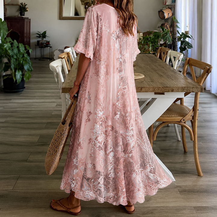 Comfortable women's floral maxi dress with split neck and half sleeves, ideal for casual summer wear.