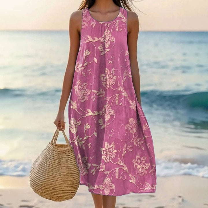 Women's floral midi dress, sleeveless & oversized, perfect for casual summer wear. Features flowy fabric & comfortable vintage style.
