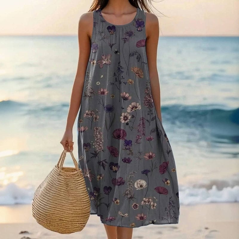 Casual women's floral midi dress with scoop neck & pockets. Sleeveless, oversized & flowy for comfortable summer vacations.