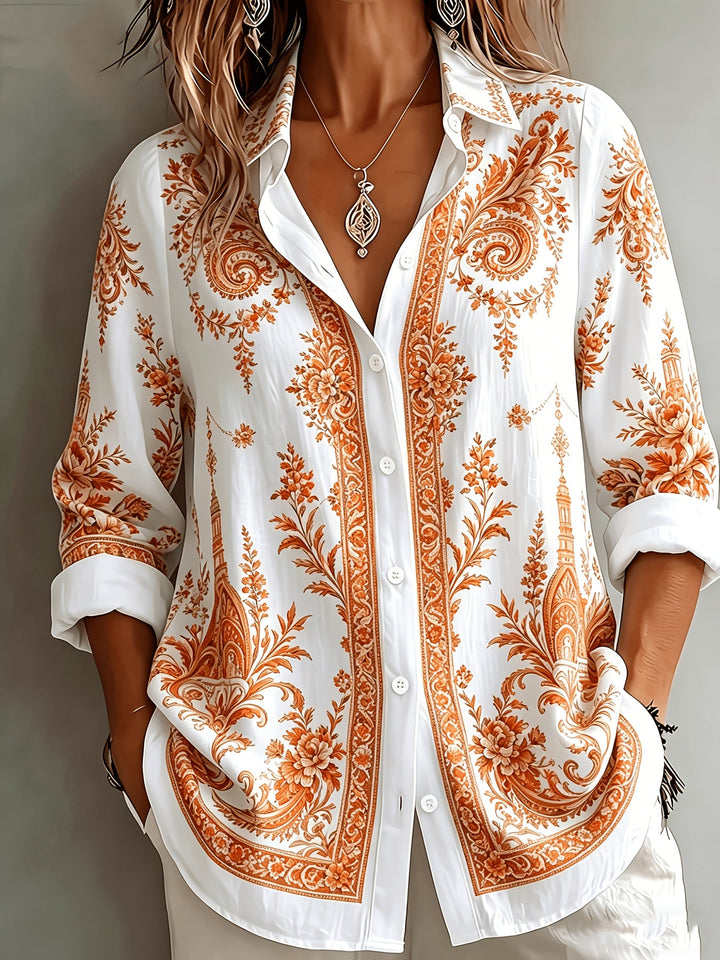Spring fashion: women's oversized floral paisley print long sleeve button-down blouse.