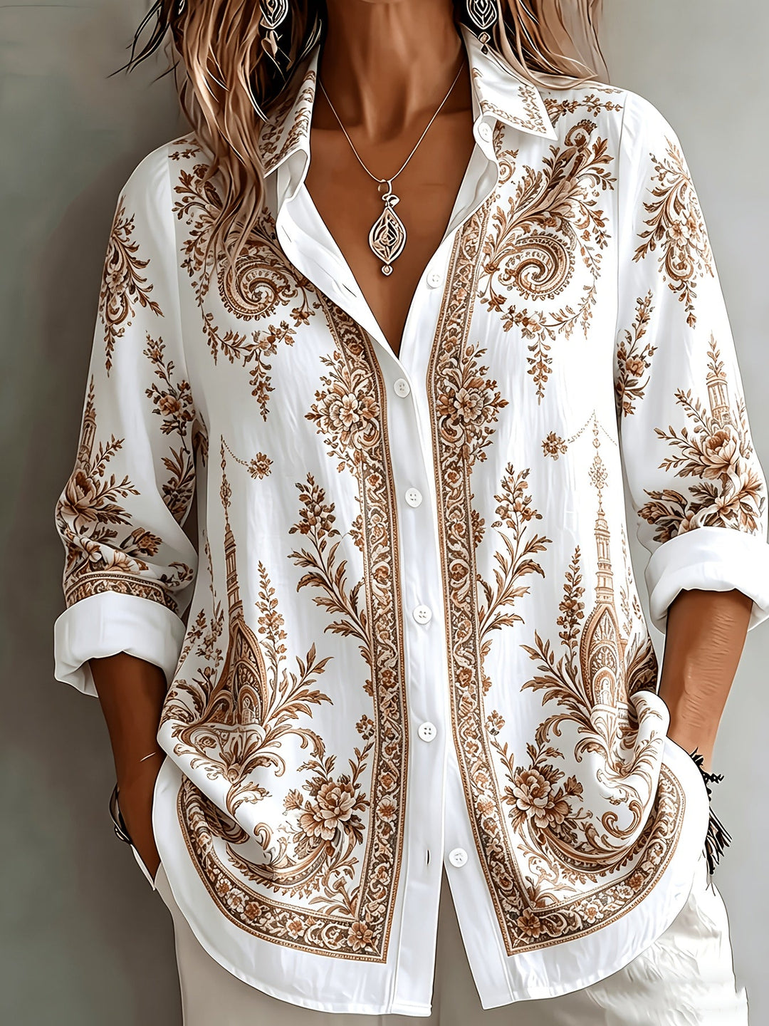 Stylish women's long sleeve oversized blouse featuring a vibrant floral paisley print.