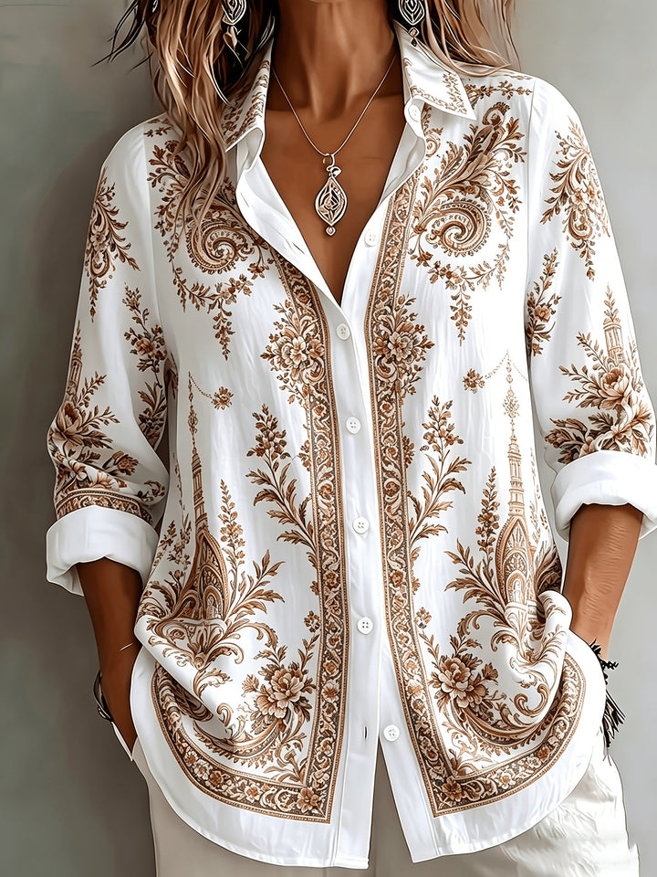 Stylish women's long sleeve oversized blouse featuring a vibrant floral paisley print.