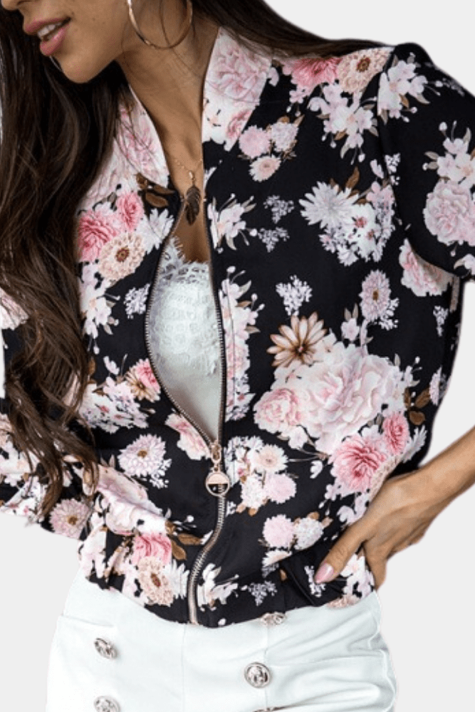 Elegant women's floral stretch jacket with zip-up design, offering performance and athleisure style.