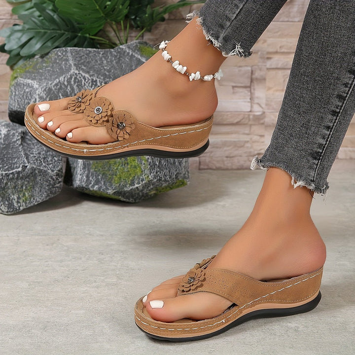 Elegant women's floral wedge sandals with platform. Comfortable summer slip-on fashion.