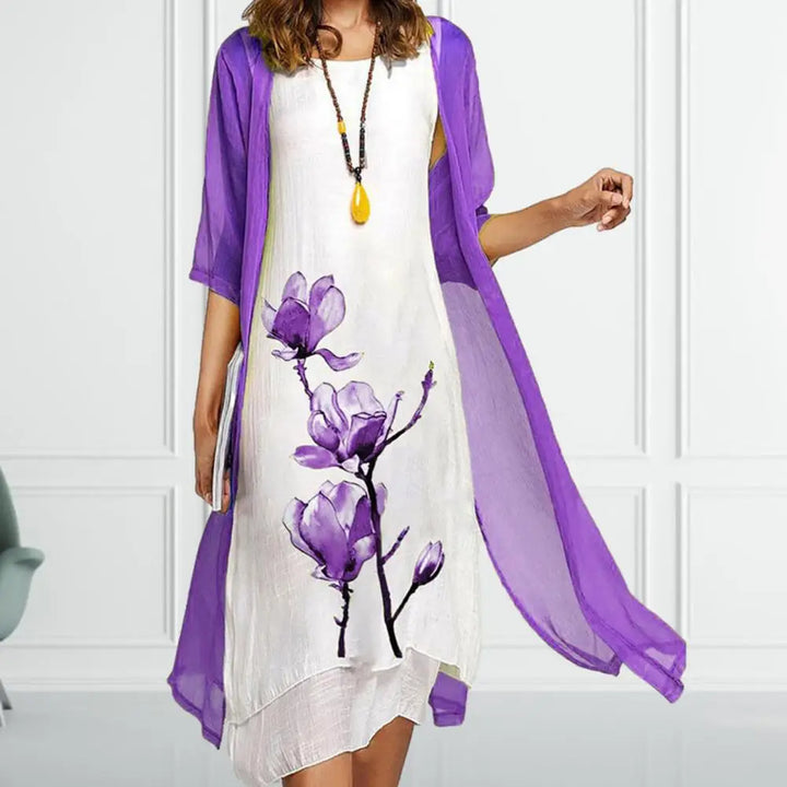 Elegant women's floral print matching set: sleeveless midi dress & sheer cardigan. Versatile spring/summer outfit.