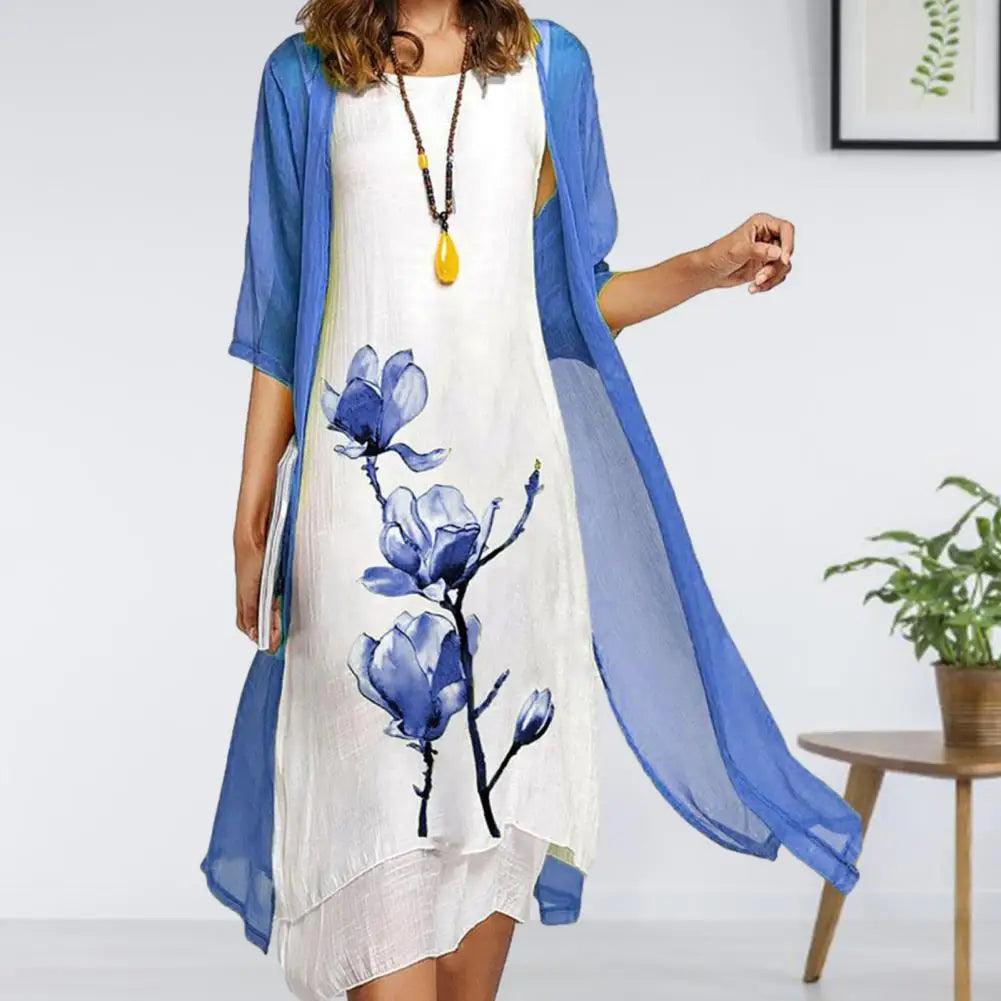 Stylish women's floral print two-piece dress featuring a flowing midi dress and sheer long-sleeve cardigan.