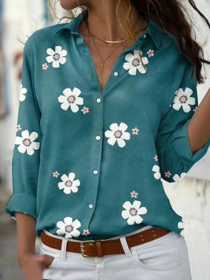 Relaxed fit women's floral print button-front blouse with long sleeves, ideal for comfortable casual or work fashion.