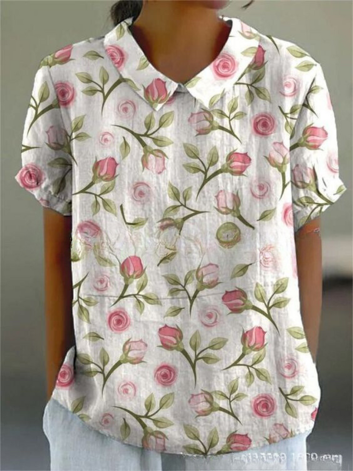 Women's elegant floral print collared short sleeve blouse. Ideal for stylish everyday fashion & summer casual wear.