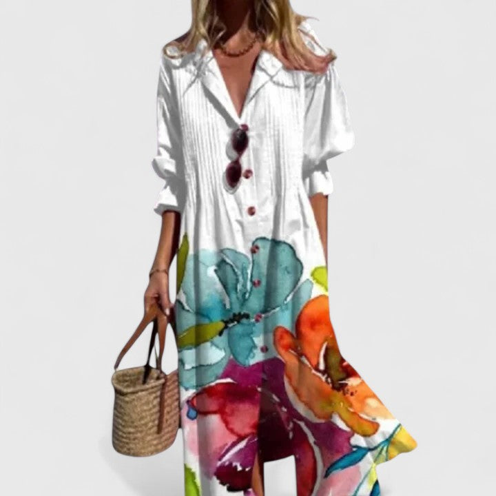Elegant floral midi shirtdress featuring delicate pintuck pleats, half sleeves, and a flattering v-neck.