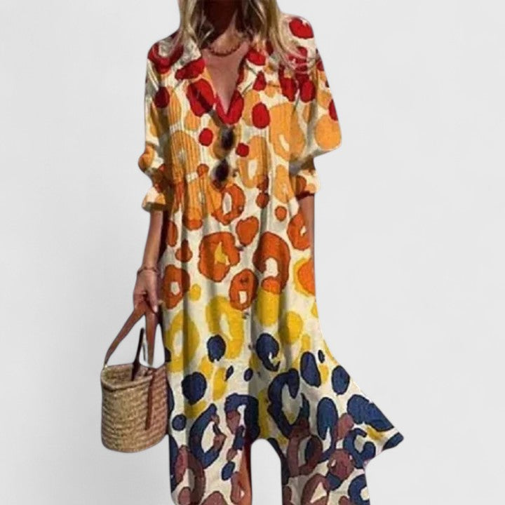 Stylish women's floral midi shirtdress with a button-down front, v-neck, and pintuck details. Great for everyday.