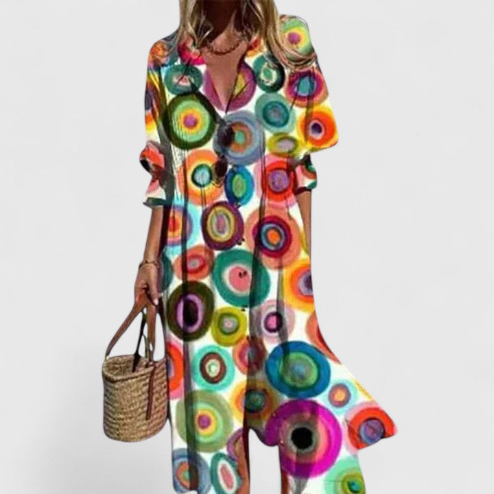 Women's V-neck floral midi shirtdress with pintuck pleats, button-down front, and half sleeves for summer.