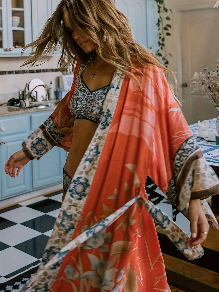 Flowy women's floral print kimono, a versatile lightweight beach cover-up and summer resort fashion layer.