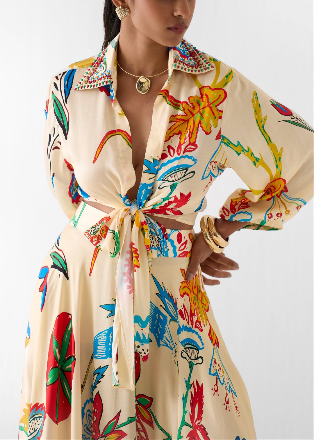Beautiful floral print women's matching set featuring a tie-front blouse and an elegant maxi skirt.