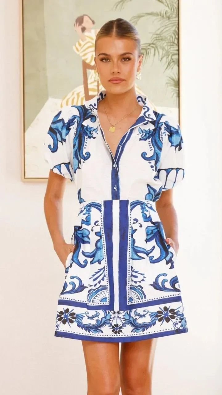 Women's party dress: a beautiful floral print mini with puff sleeves. Elegant summer style.