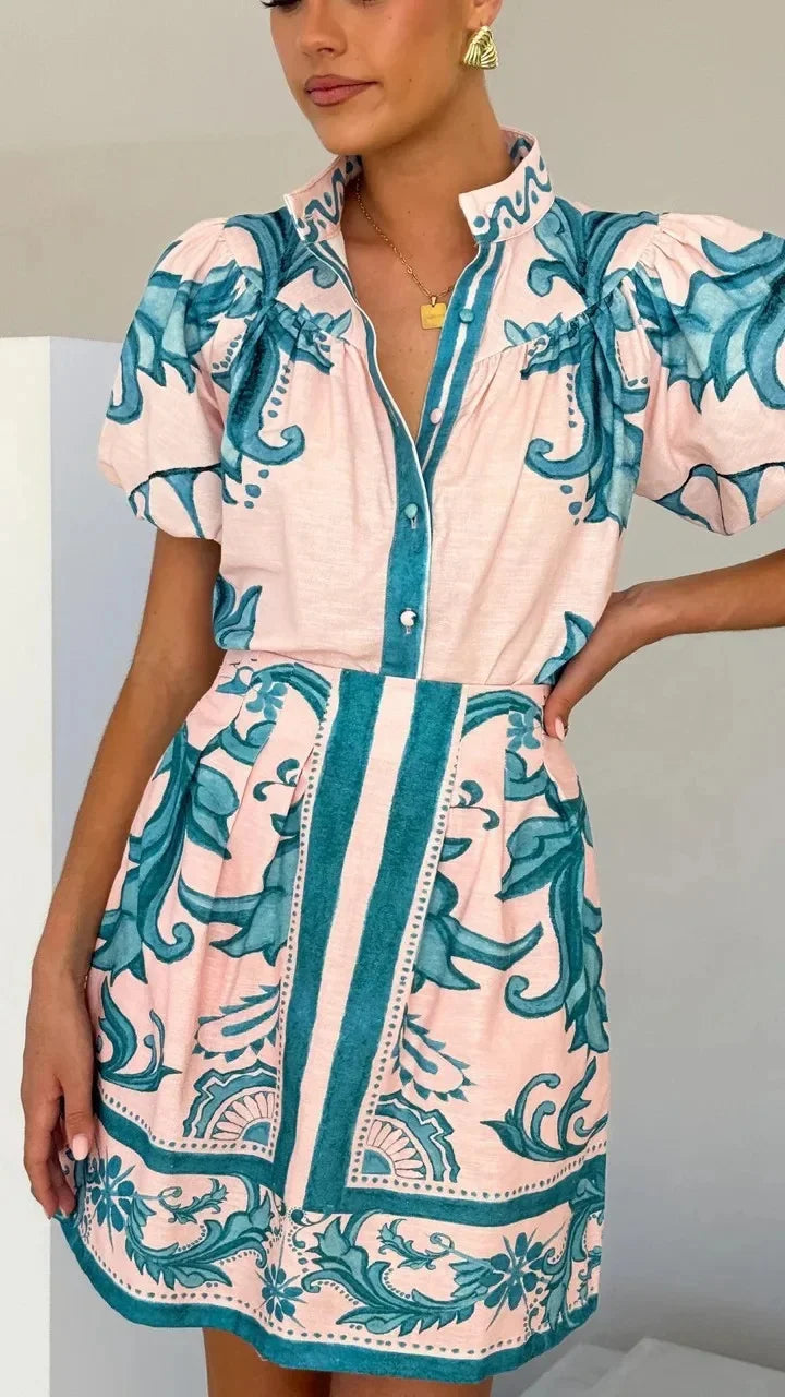 Summer style floral print puff sleeve mini dress. Women's elegant cocktail attire.